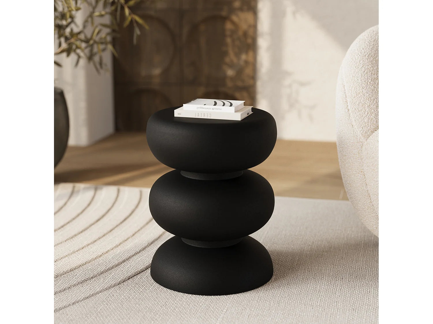 Bout de canapé rond en métal noir sculptural – TRIVELA